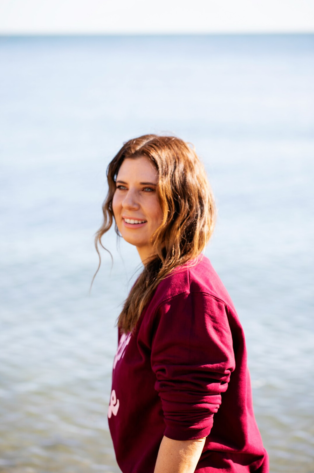 Portrait of a woman with long hair smiling